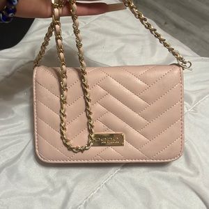 light pink cross body bag